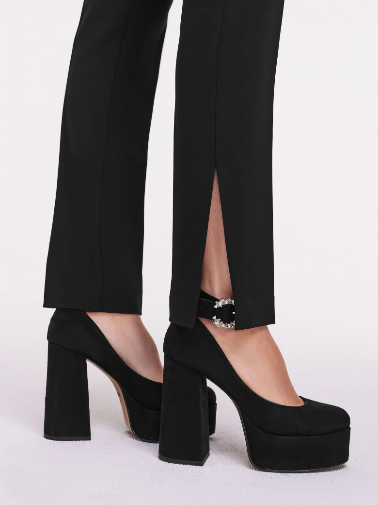 Black high-waisted pants with straight legs