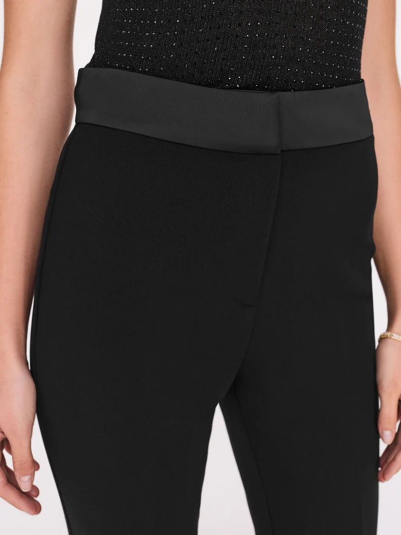 Black high-waisted pants with straight legs