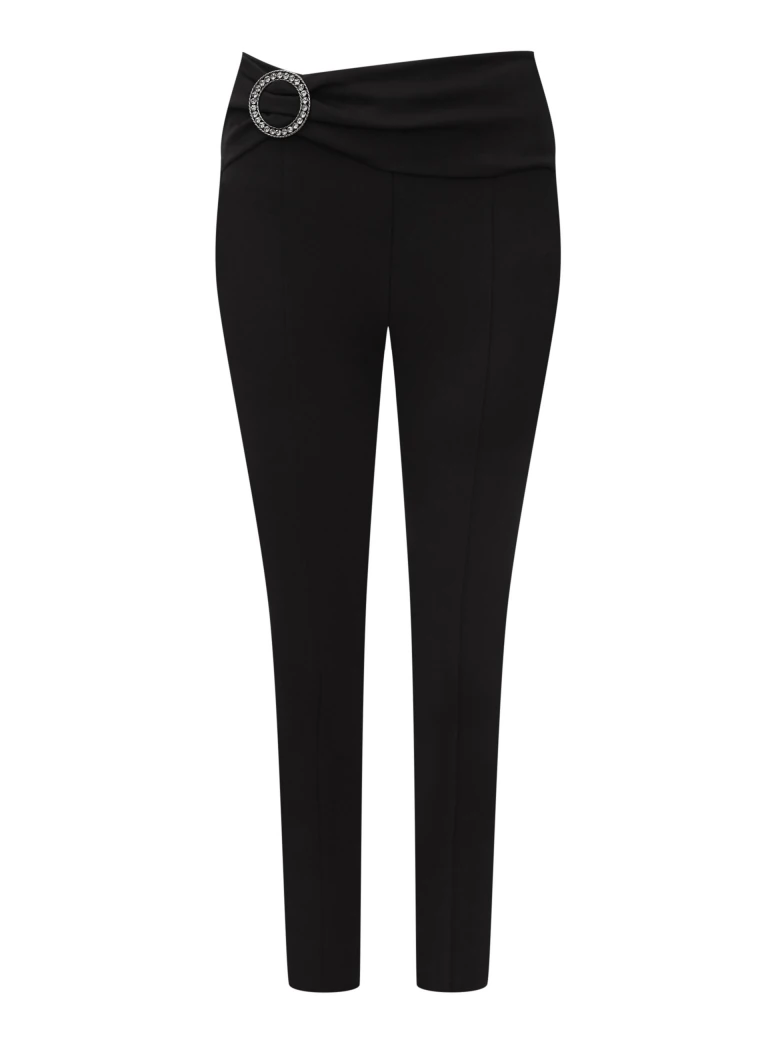 Black high-waisted pants with a clutch