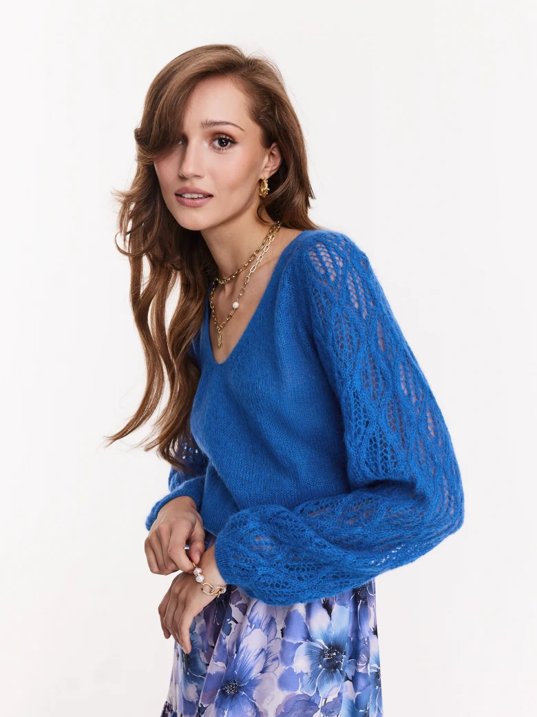 Blue sweater with openwork sleeves
