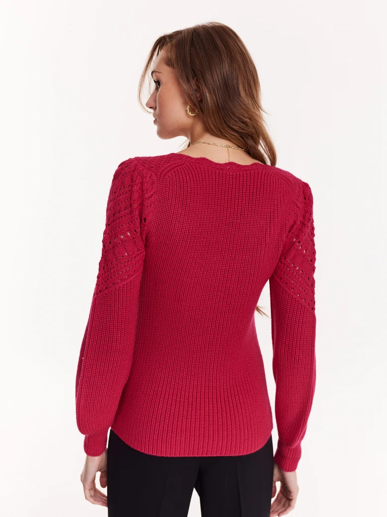 Openwork sweater in a shade of fuchsia