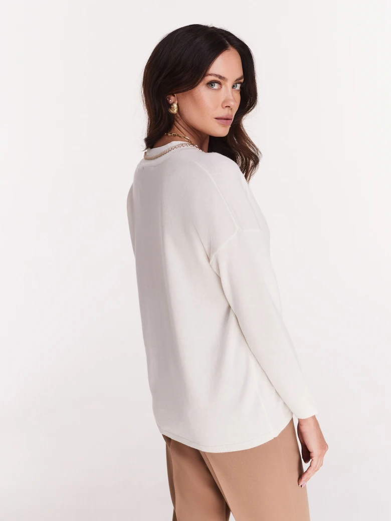 White oversize sweater with heart neckline