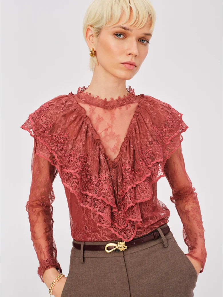 Lace blouse with brick-colored embellishments