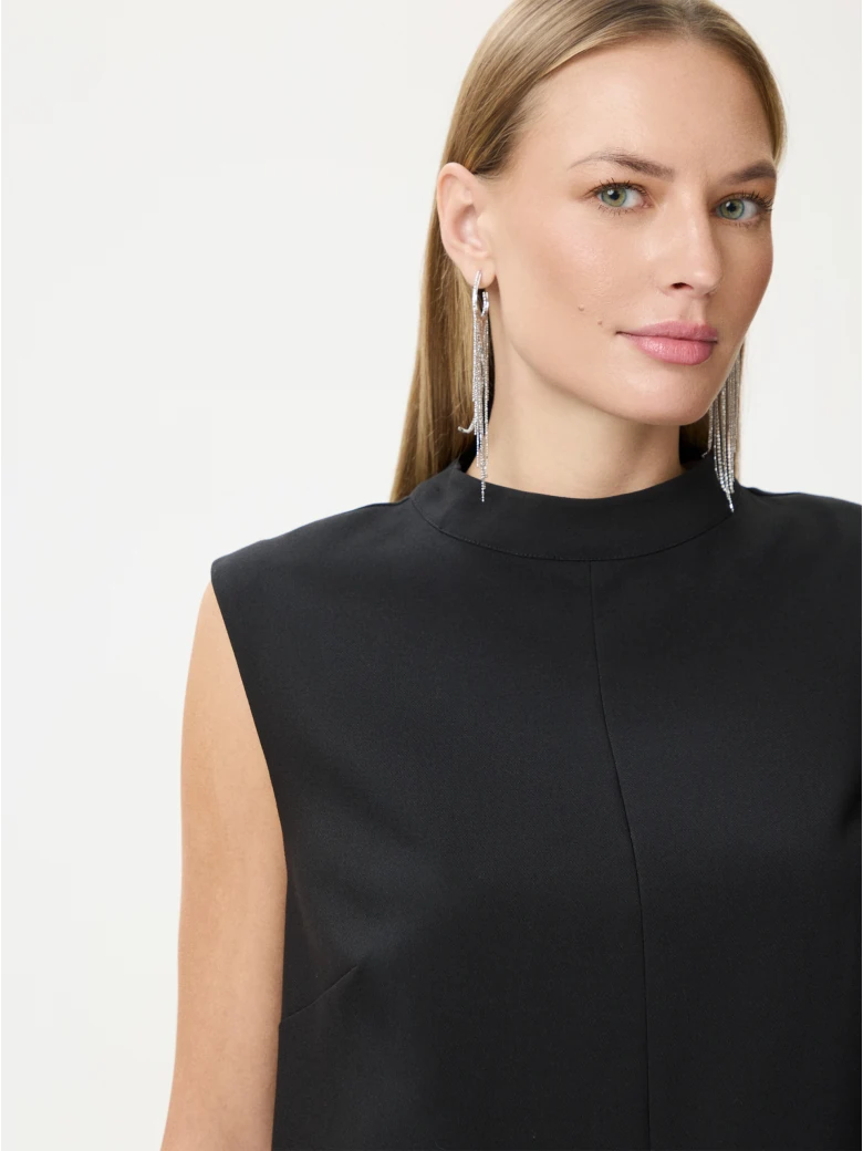 Black sleeveless blouse with decorative trim