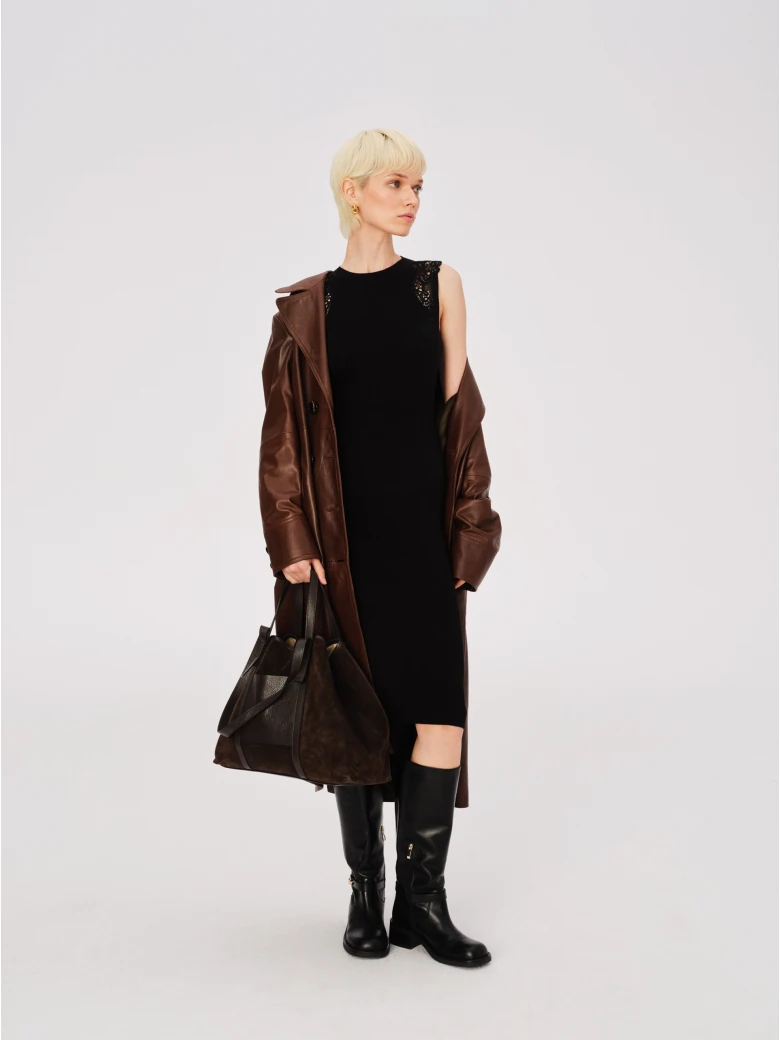 Black fitted dress with openwork inserts