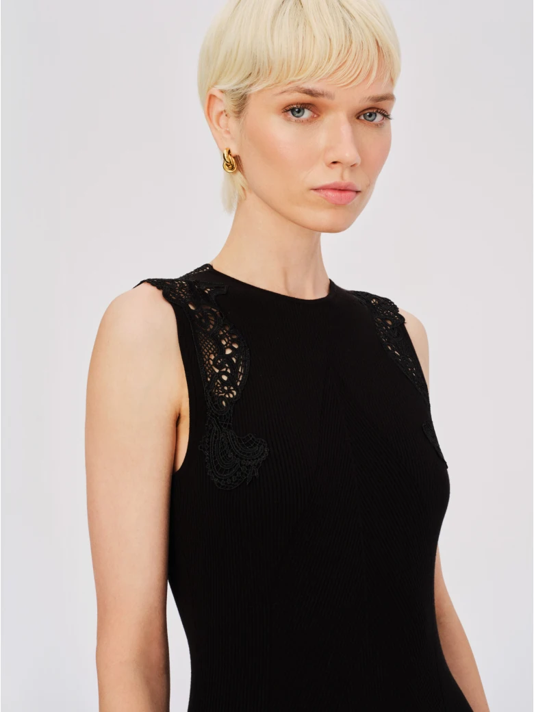 Black fitted dress with openwork inserts