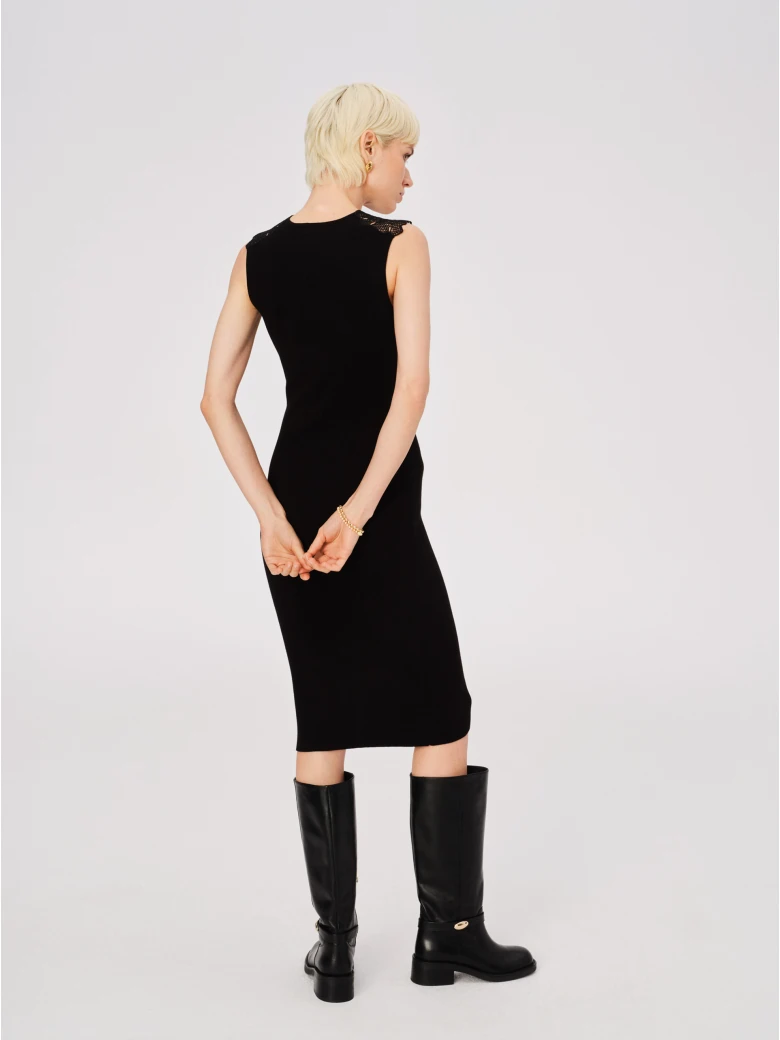 Black fitted dress with openwork inserts