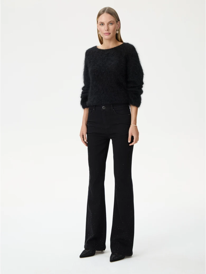 Black bell-bottom pants with shiny detail
