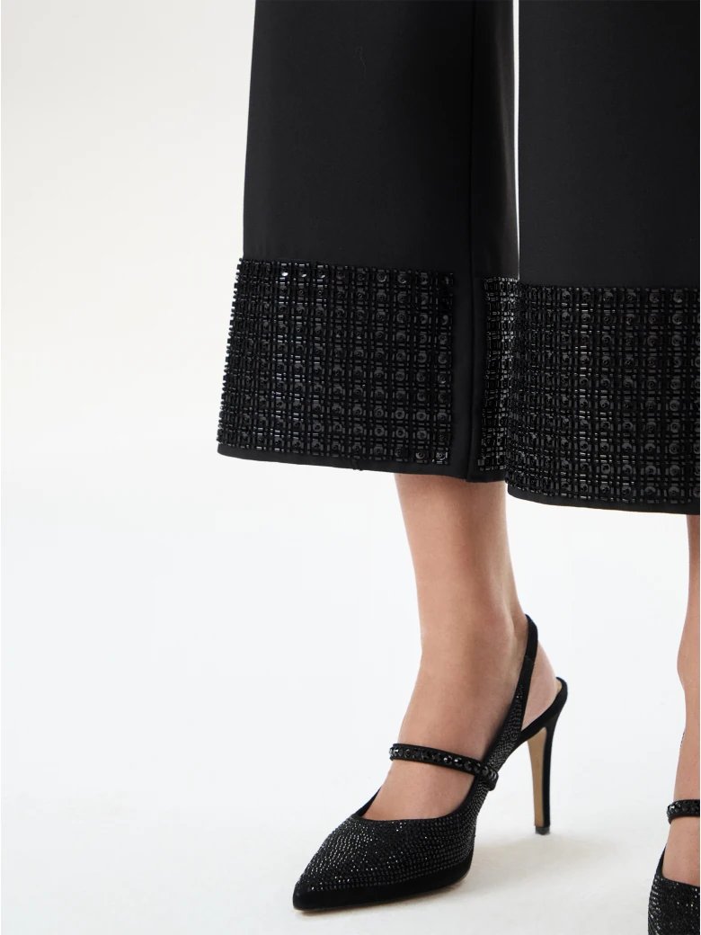 Black ⅞ pants with decorative legs