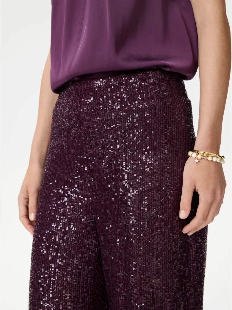 Long sequined pants in burgundy