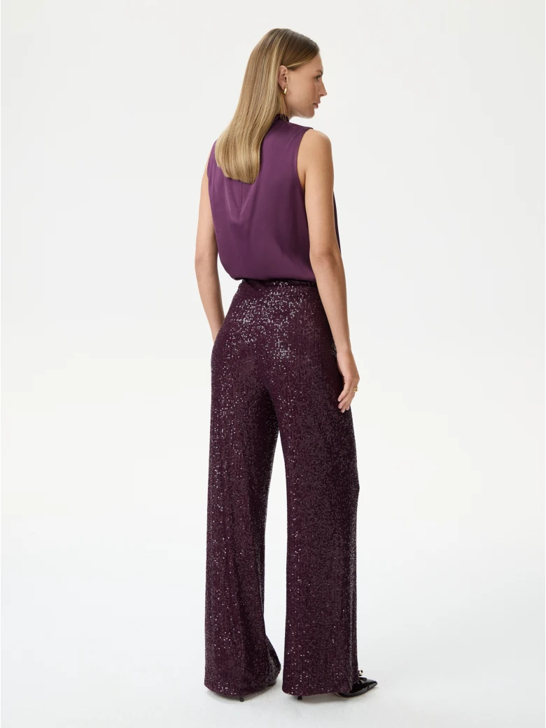 Long sequined pants in burgundy