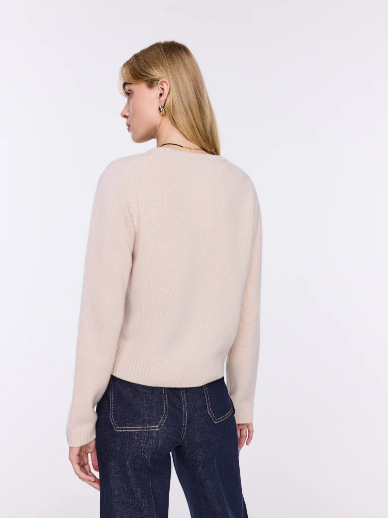 Beige wool sweater with a simple cut