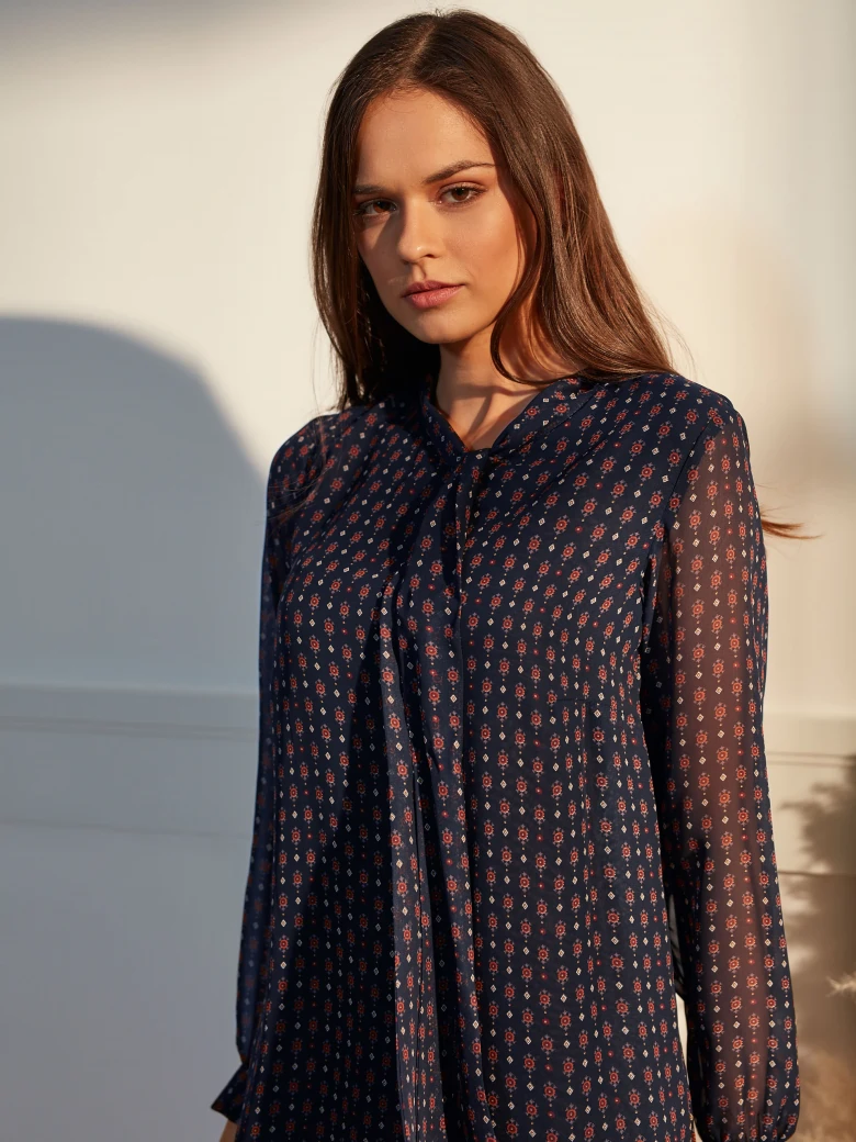 DRESS WITH A RUFFLE AT THE BOTTOM