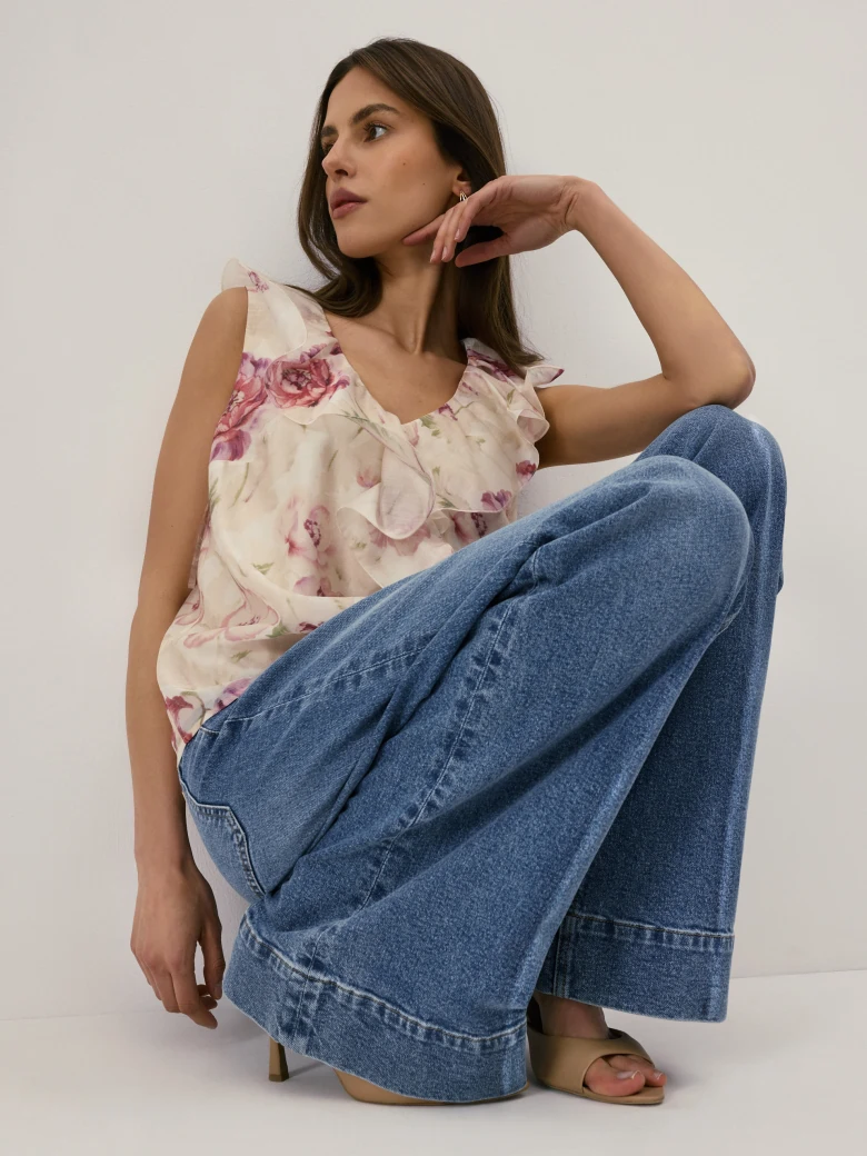 A cream-coloured floral viscose blouse