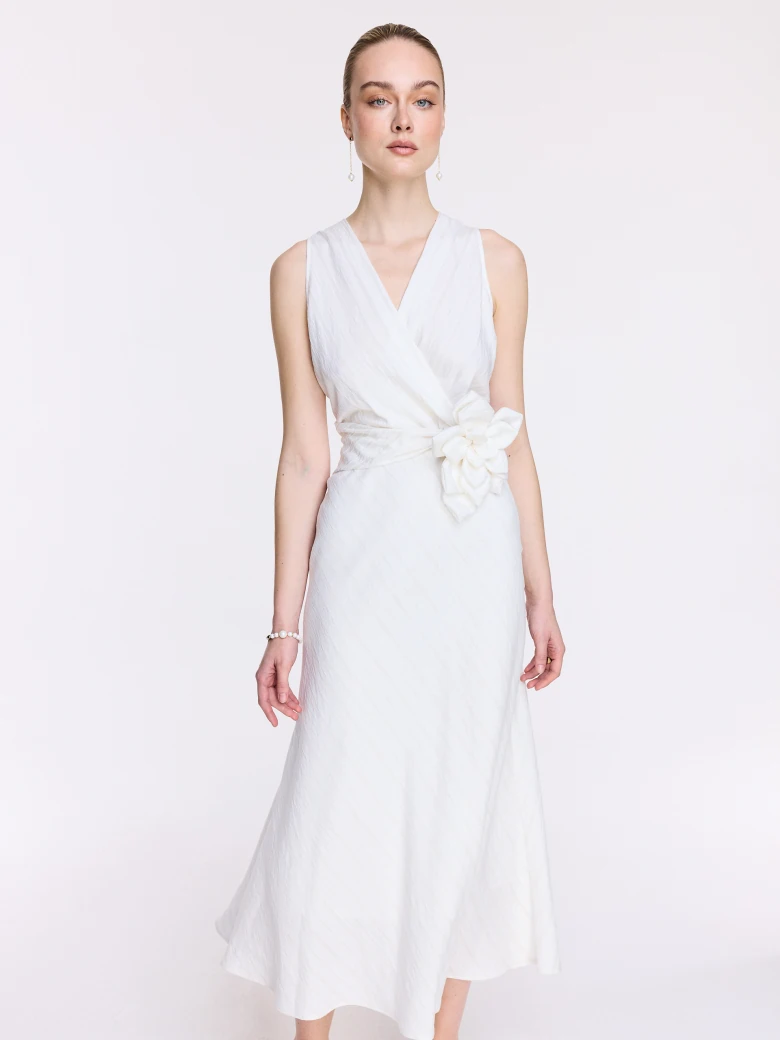 An elegant white midi dress with linen