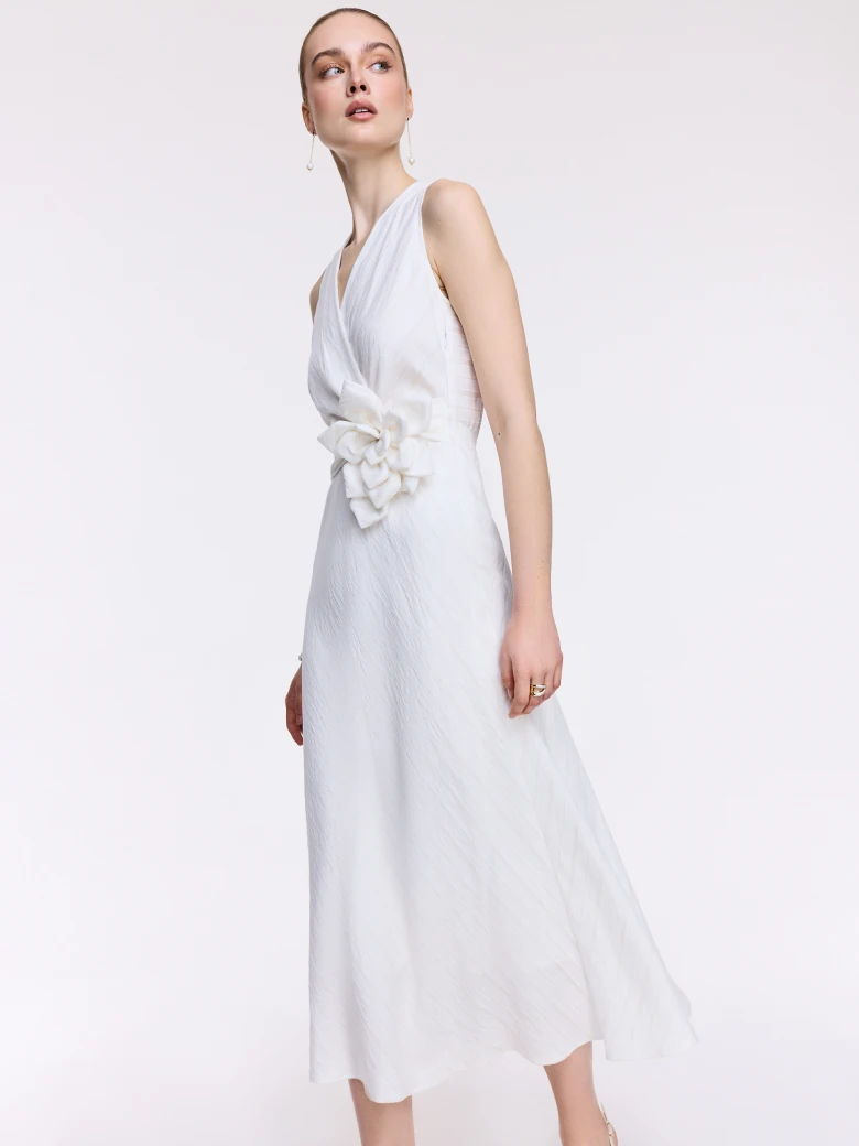 An elegant white midi dress with linen