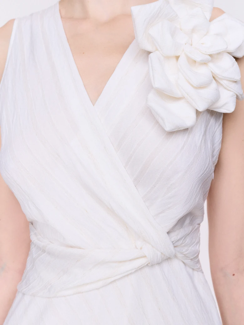 An elegant white midi dress with linen