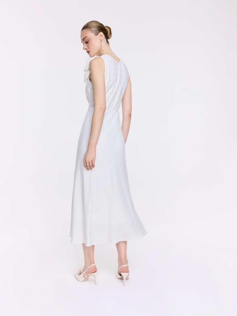 An elegant white midi dress with linen