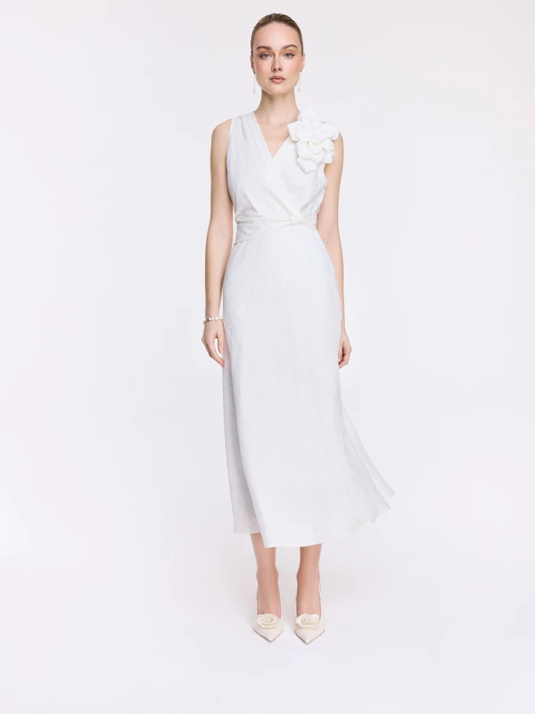An elegant white midi dress with linen