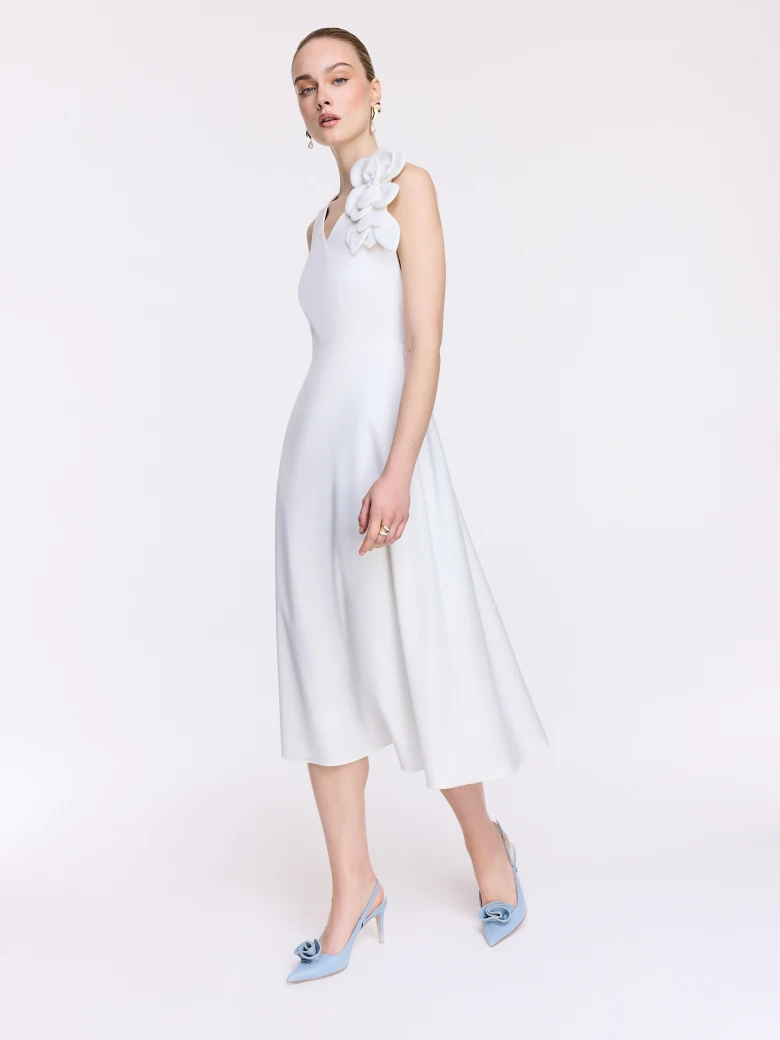 White midi dress with a decorative flower