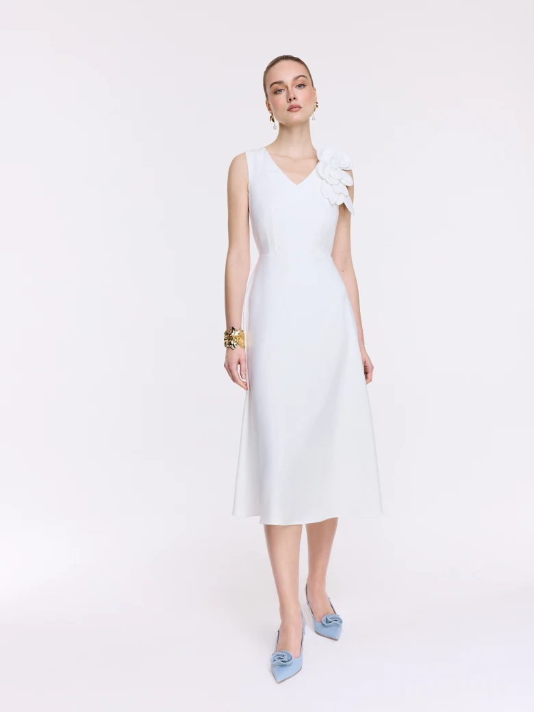White midi dress with a decorative flower