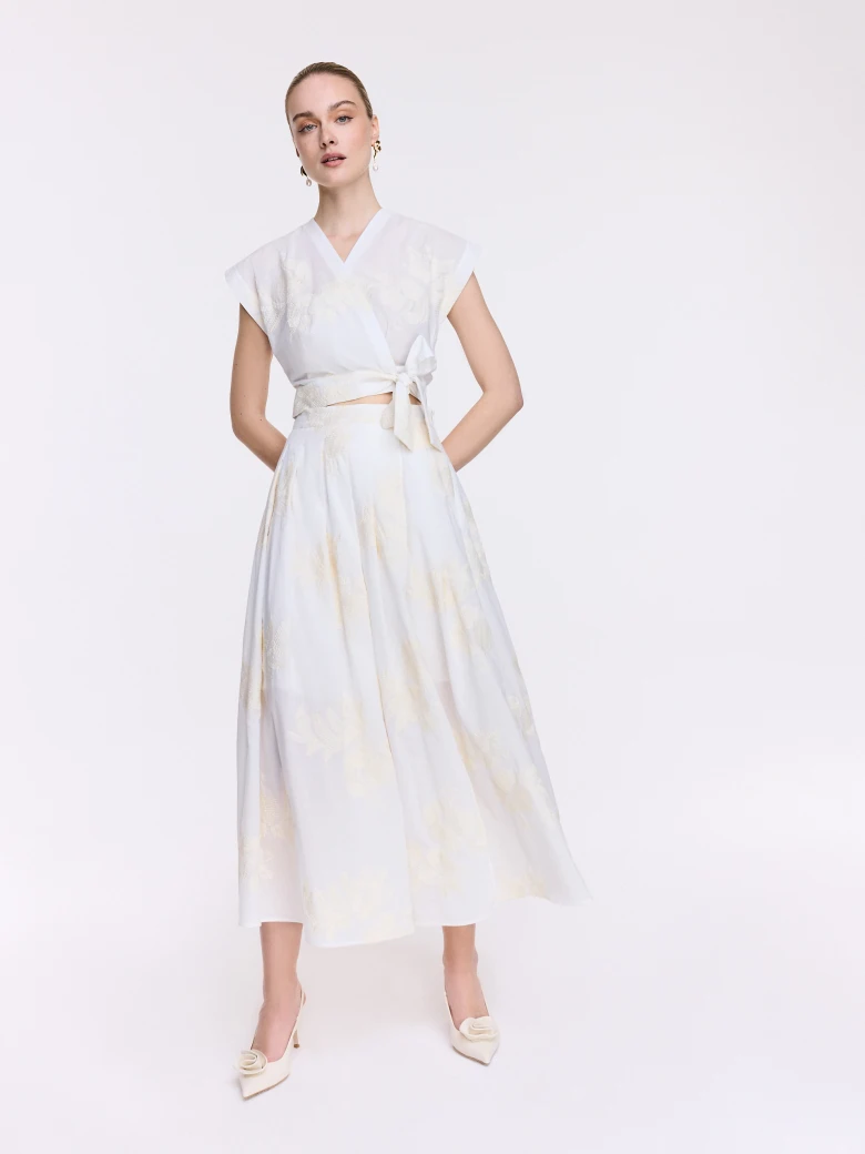 High-waisted cream-colored embroidered skirt