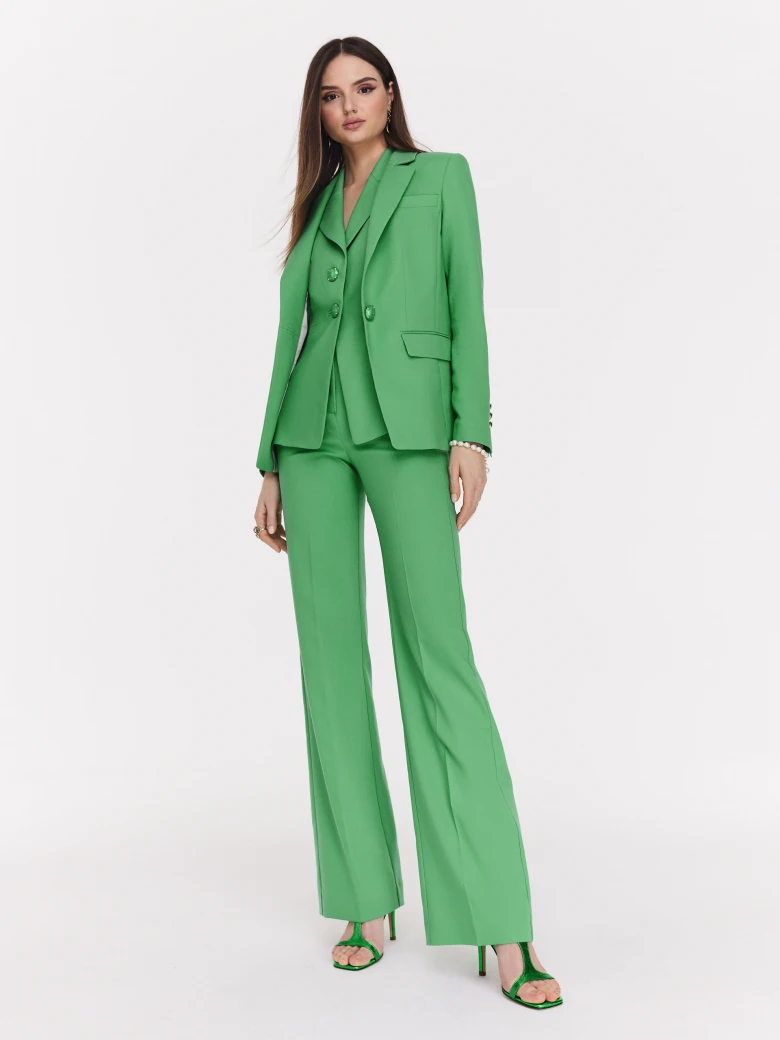 Classic green jacket with a single button closure