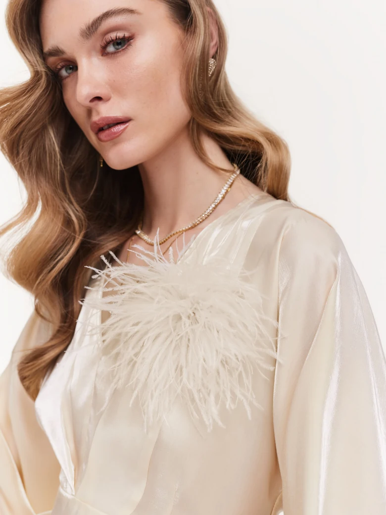 Cream brooch with feathers