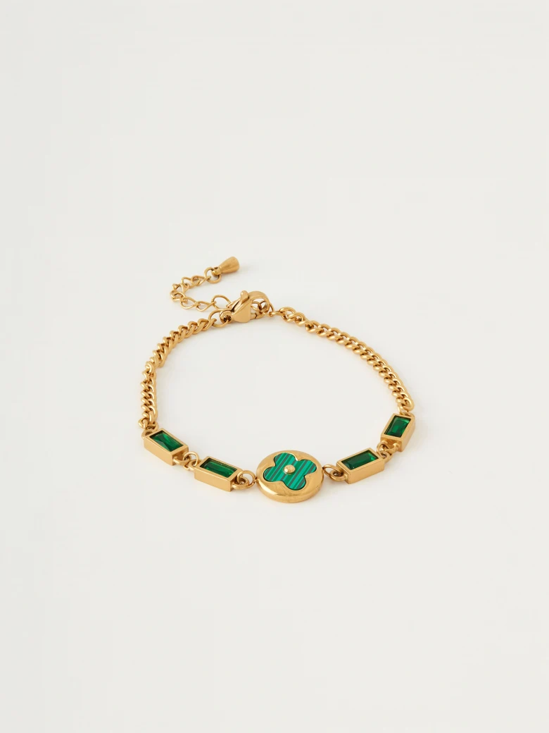Gold color bracelet with green stones