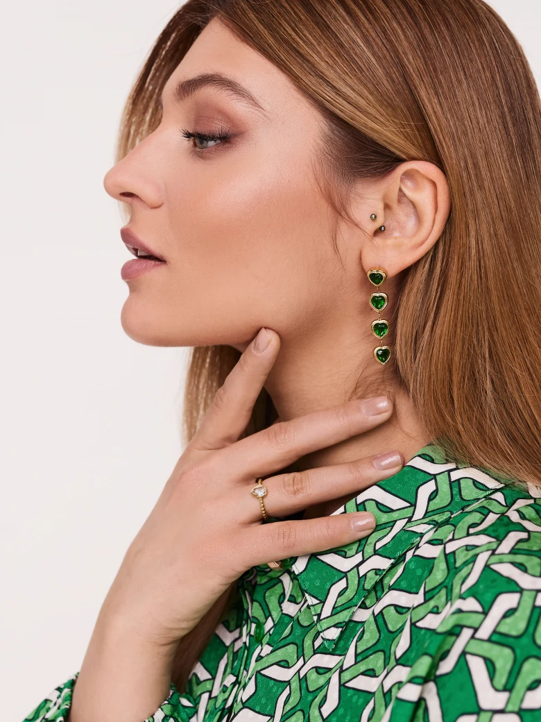 Gold-tone earrings with green hearts