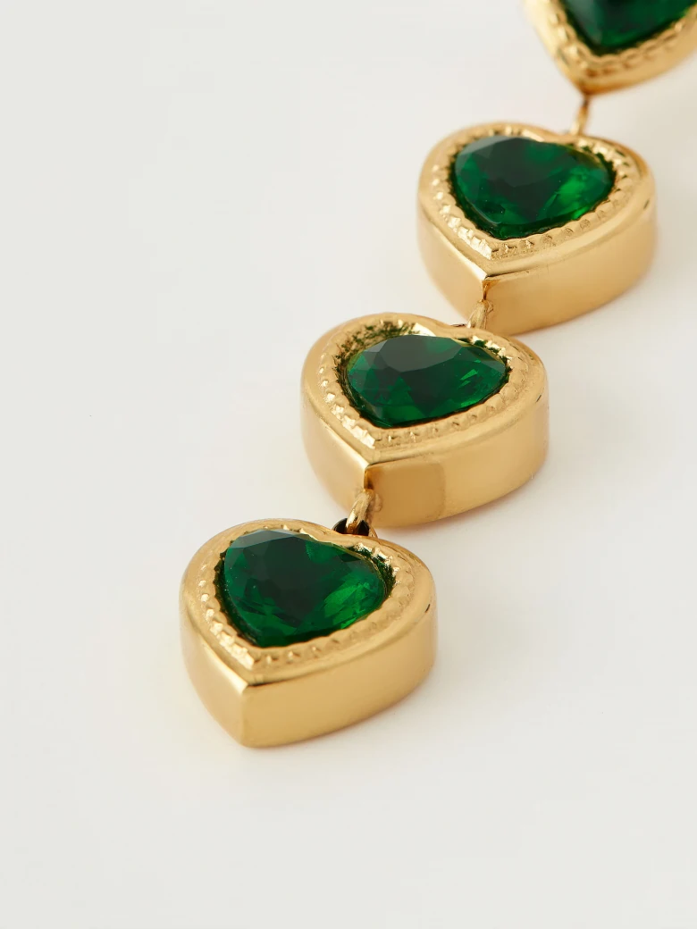 Gold-tone earrings with green hearts