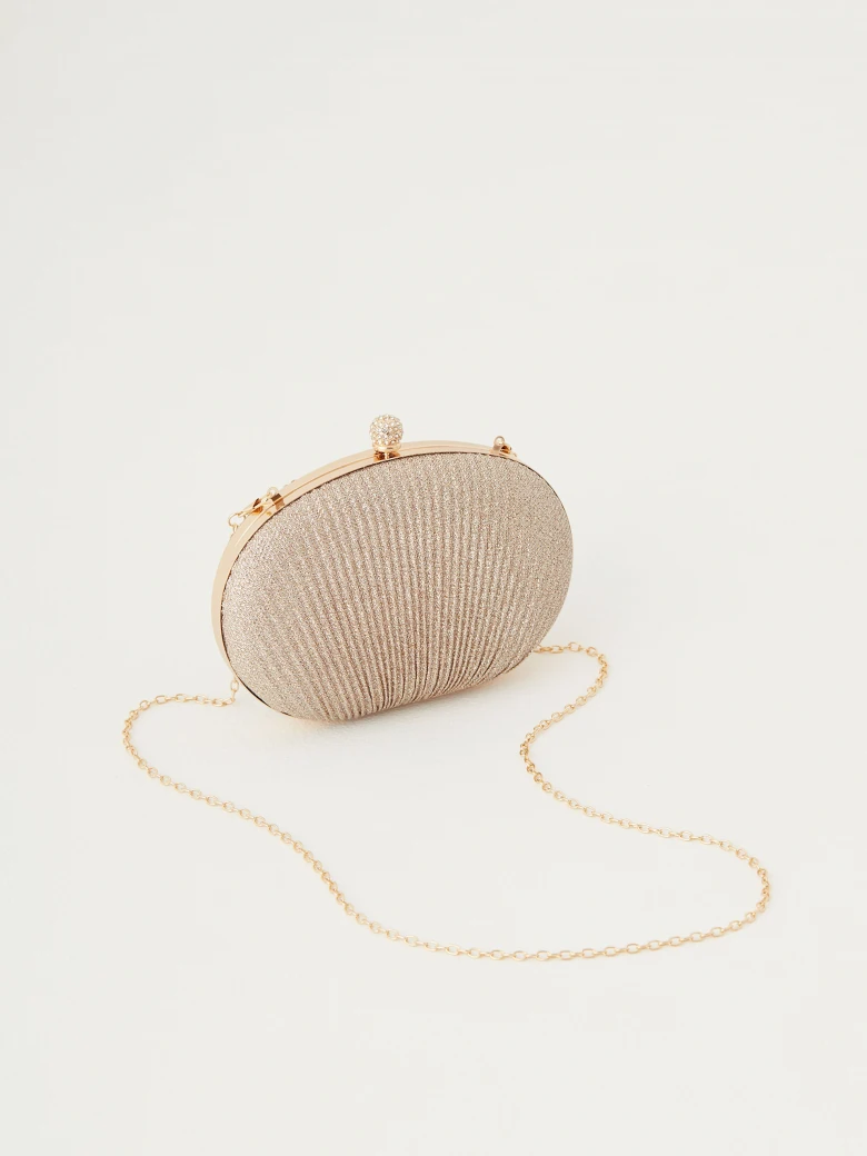 Shell-shaped bag made of shiny material