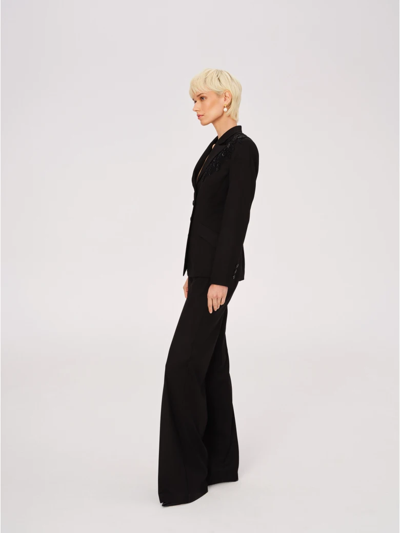 Elegant black pants with jeweled appliqué