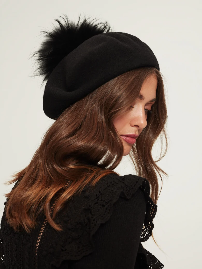 Black beret with decorative pom-pom