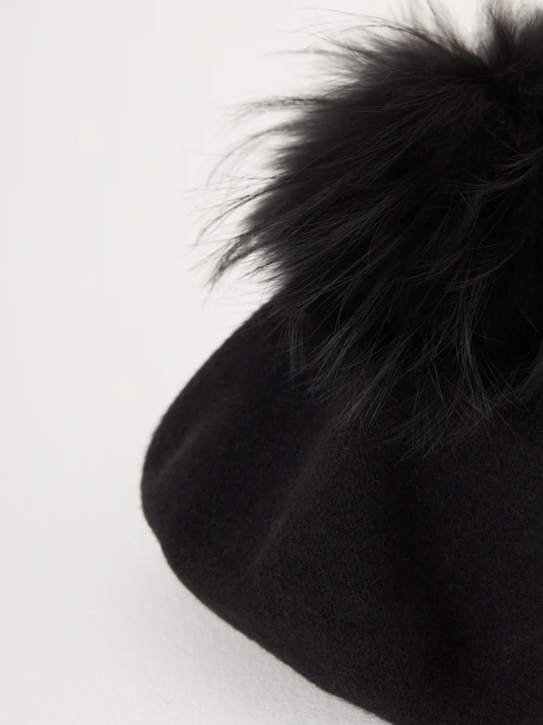Black beret with decorative pom-pom