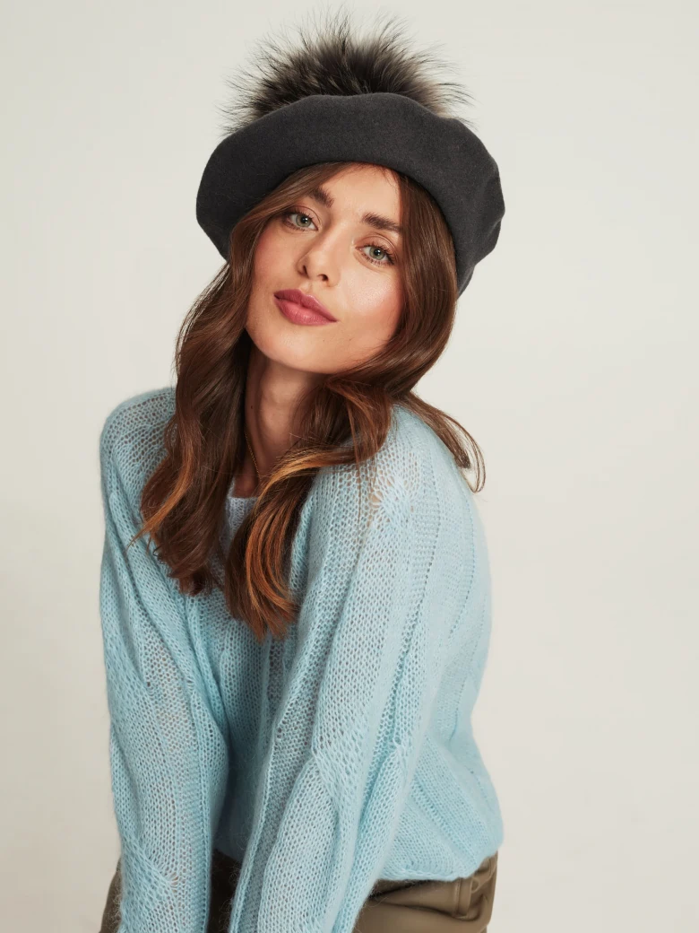 Grey beret with decorative pom-pom