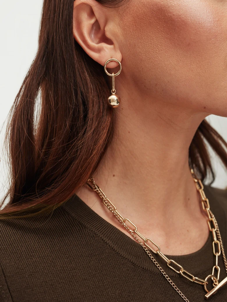 Earrings finished with a gold bead