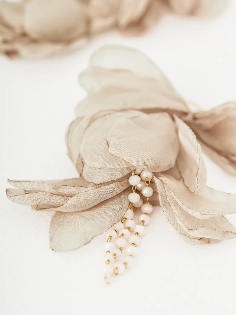 Earrings decorated with flowers and crystals