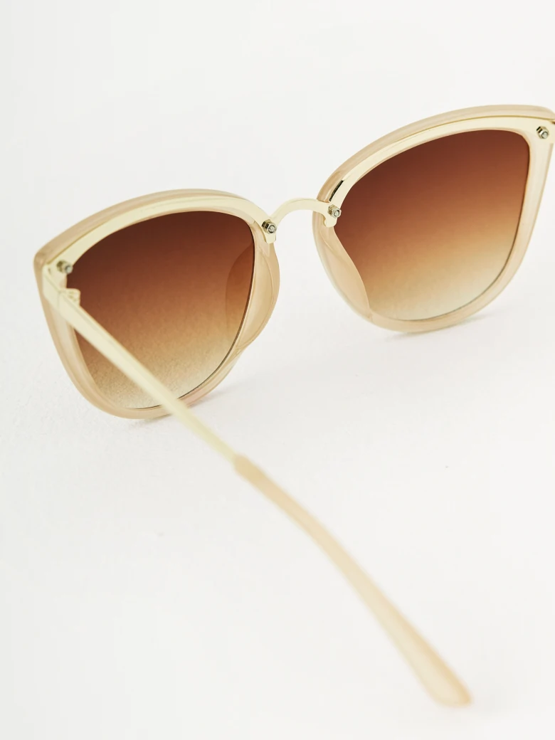 Beige sunglasses in cat-eye shape