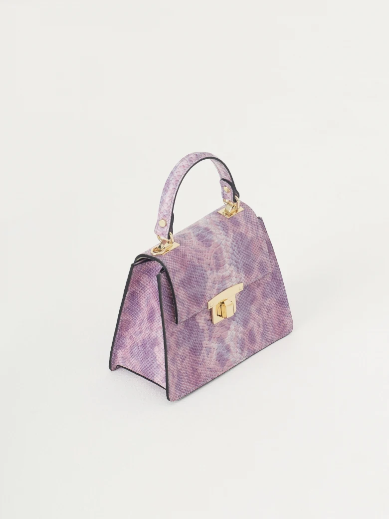 Purple handbag in the form of a trunk