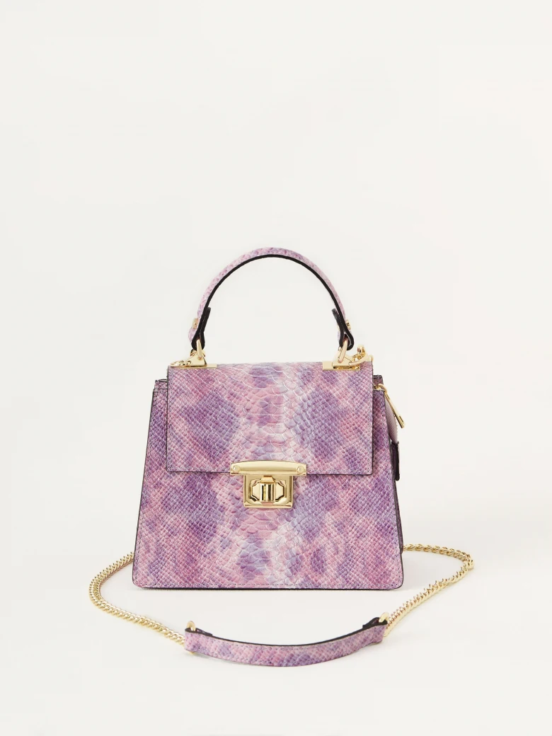 Purple handbag in the form of a trunk