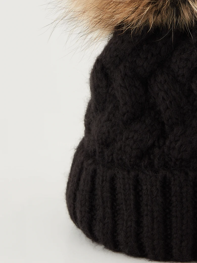 Black beanie with added wool and fur pompom