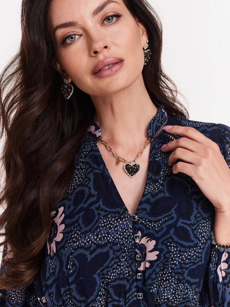 Gold-colored chain with heart-shaped pendant