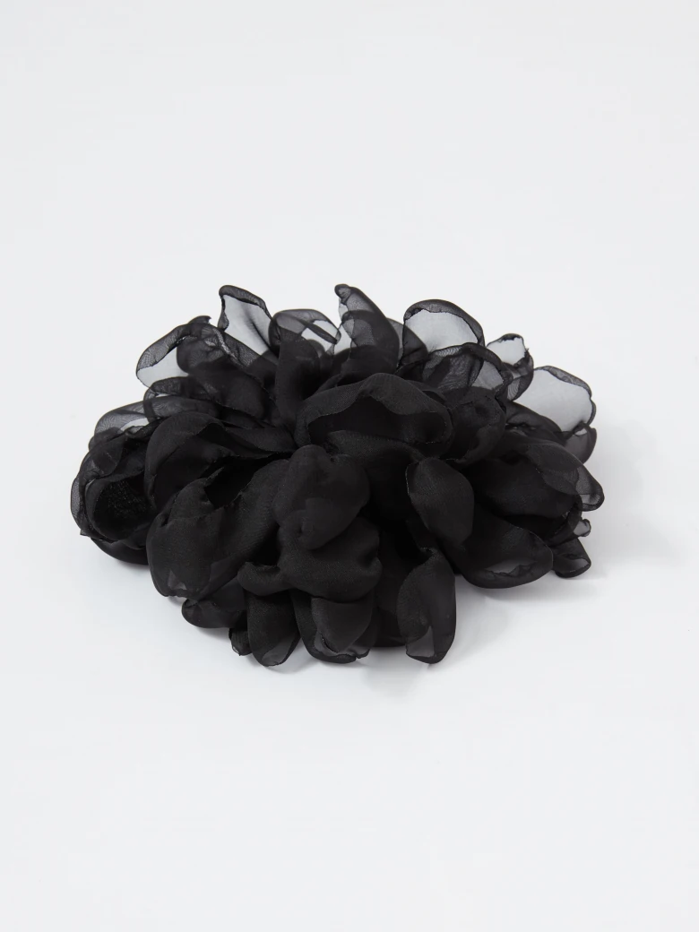 Large black flower-shaped brooch