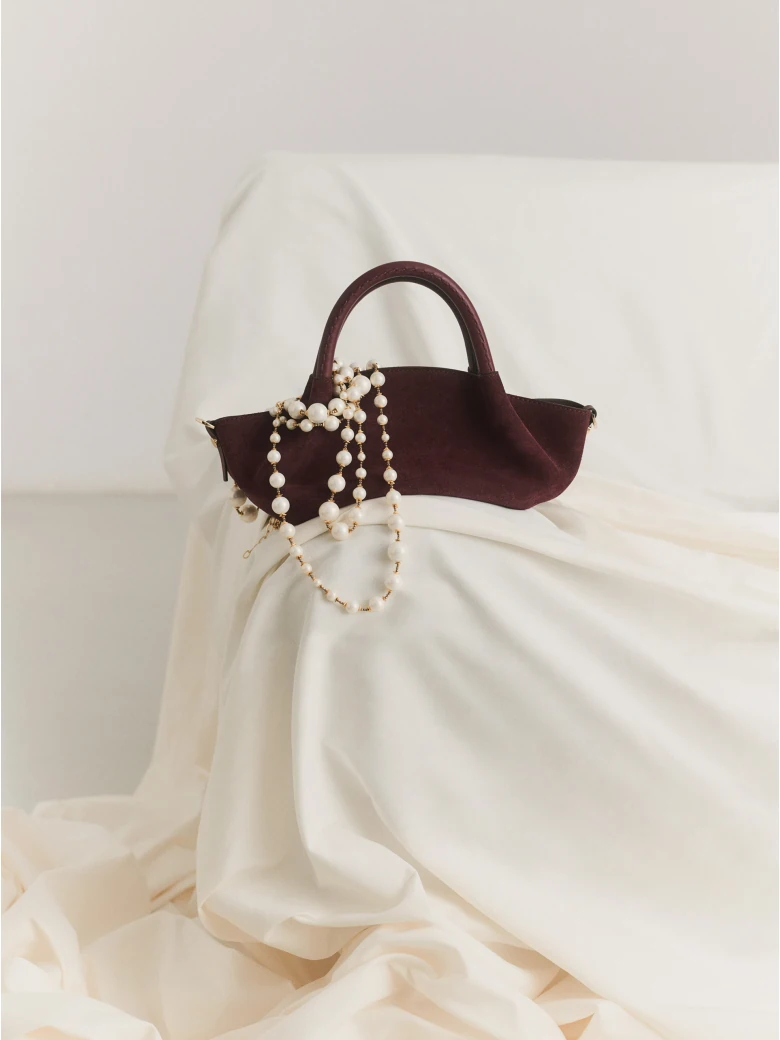 Suede handbag in burgundy