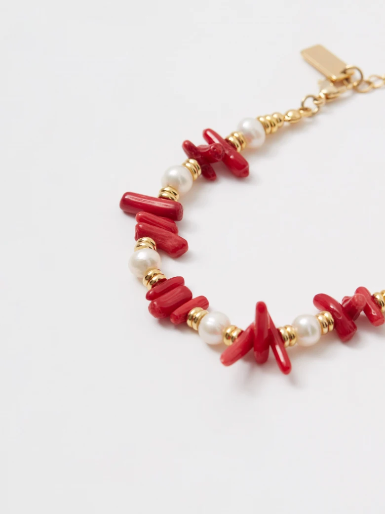 Gold-plated bracelet with pearls and red beads
