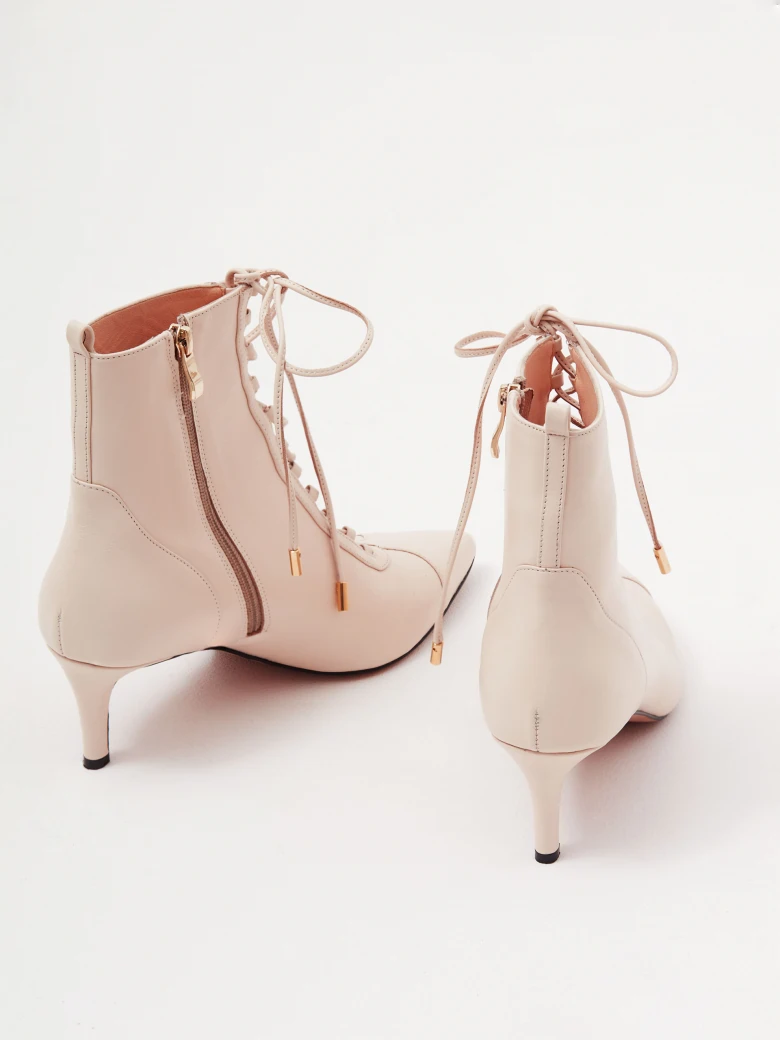 Beige heeled ankle boots made of genuine leather