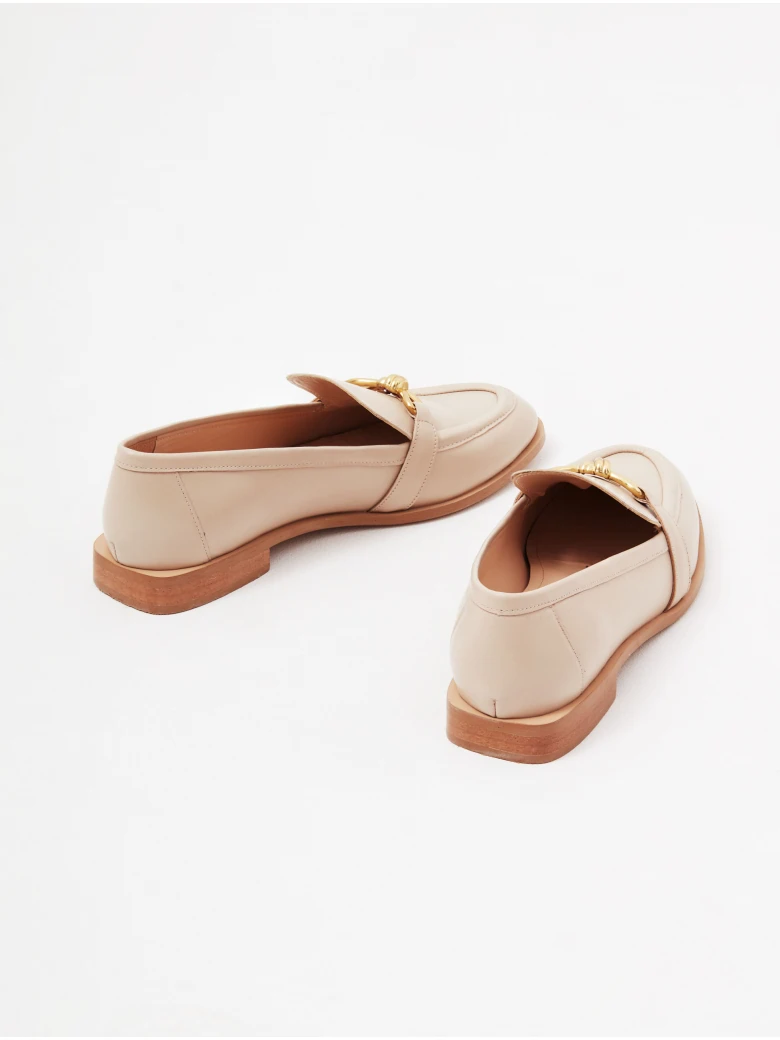Beige leather moccasins with buckles