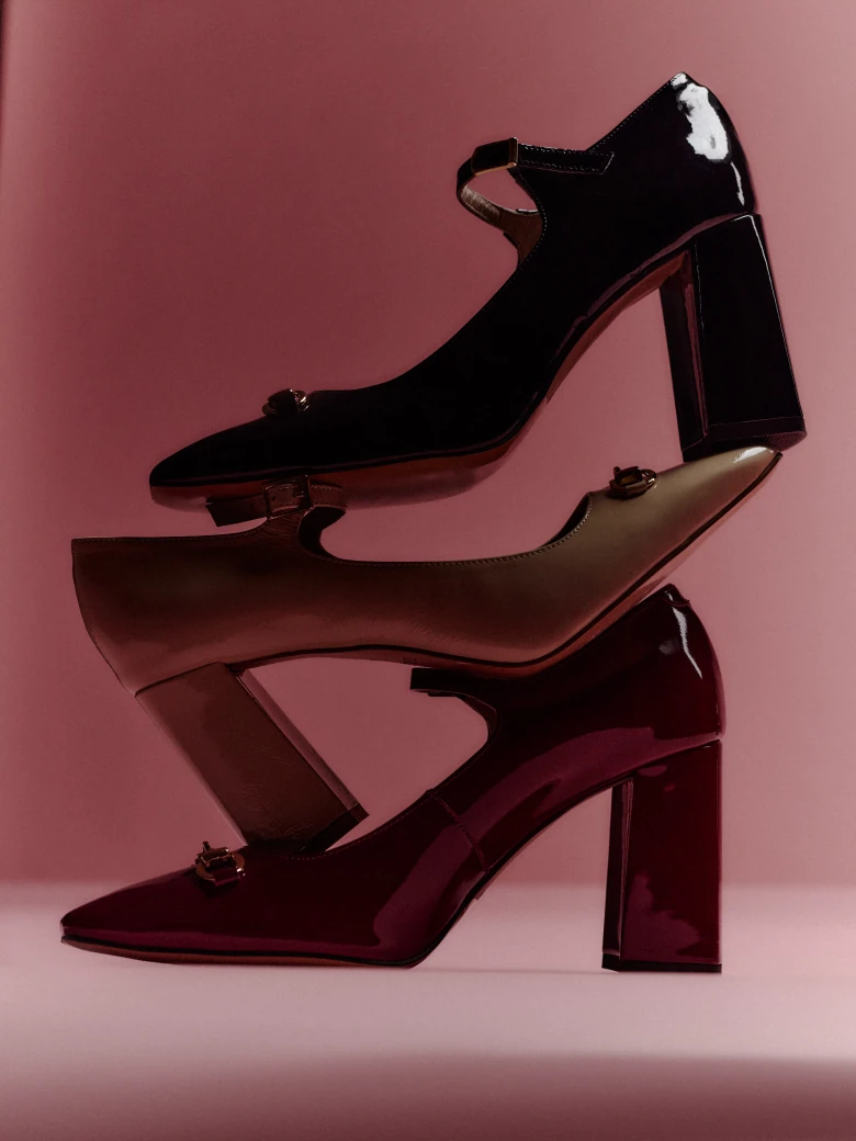 Black leather pumps with decorative buckles