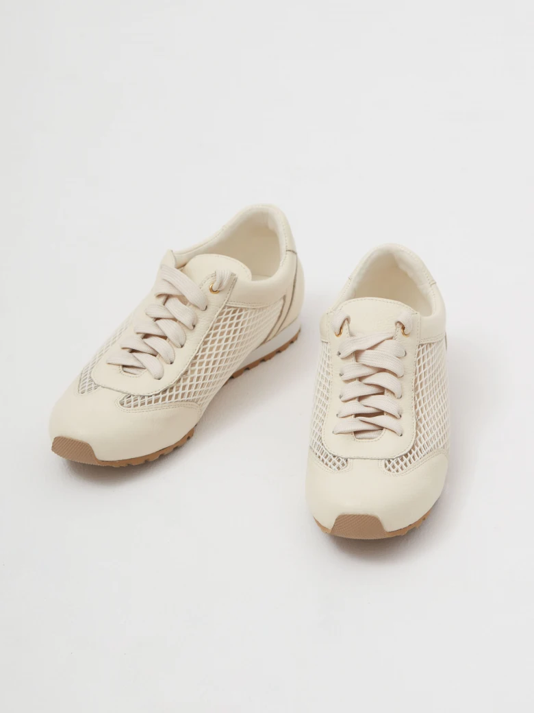 Leather cream sneakers with decorative tags